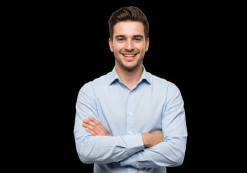 Young man in a light blue shirt with arms crossed